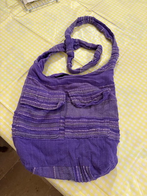 Women's purple bag used with non-working zipper