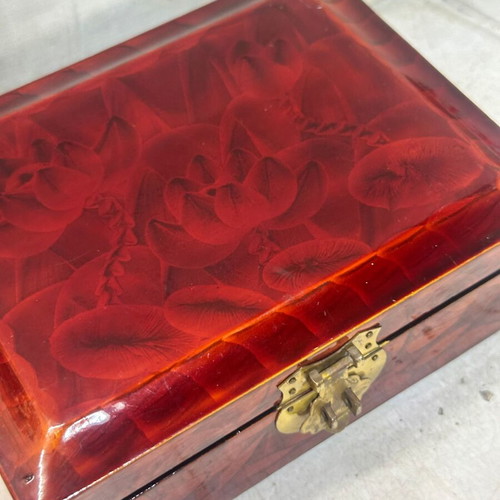 Vintage wooden jewelry box used with red satin lining