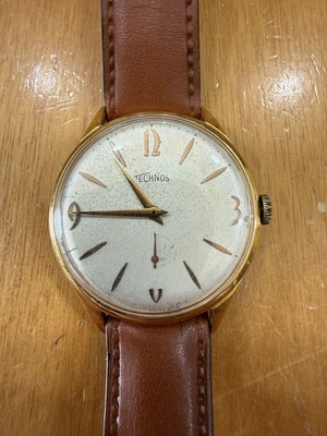 Technos wind-up watch like new, unisex, gold color