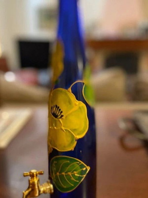 Handpainted floral liquor bottle like new