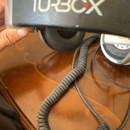 Turbo X headphones used with coiled cable and 3.5mm jack plug