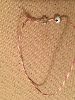Women's bracelet with cross and eye charm