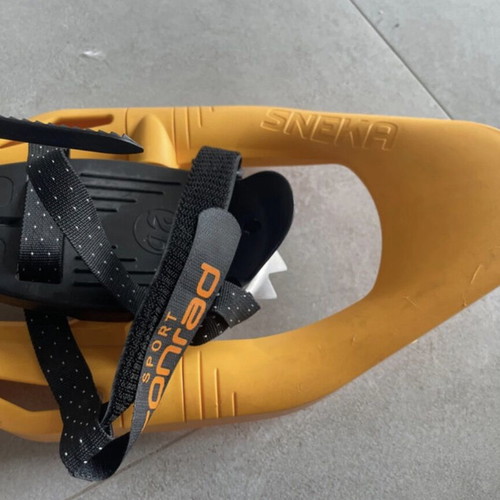 Sneka snowshoes used for hiking with metal crampons