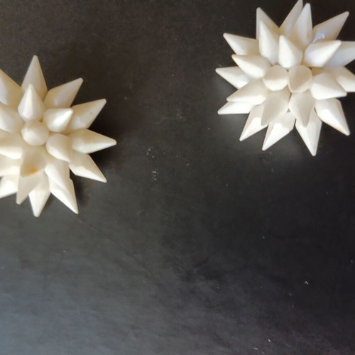 Vintage white clip-on earrings used from the 1960s