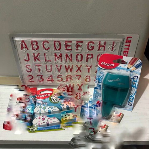 Maped school supplies set with alphabet stencil, erasers, sharpener
