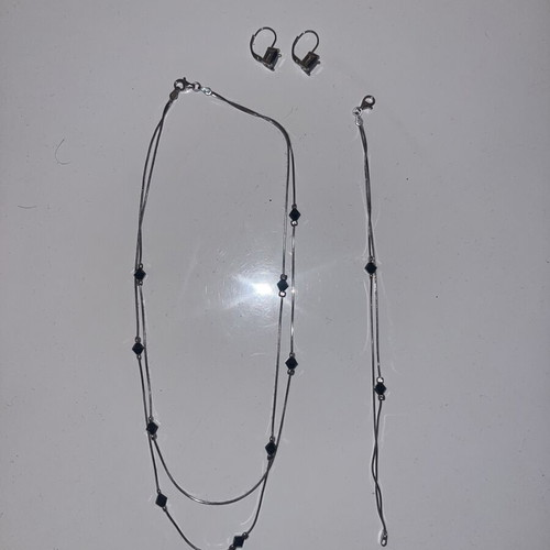 Silver jewelry set with black stones, necklace, bracelet and earrings