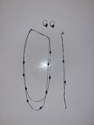Silver jewelry set with black stones, necklace, bracelet and earrings
