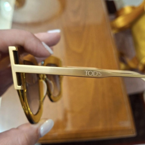 Tod's sunglasses new, gold color
