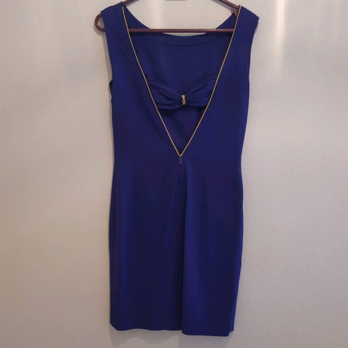 blue dress with an opening at the back