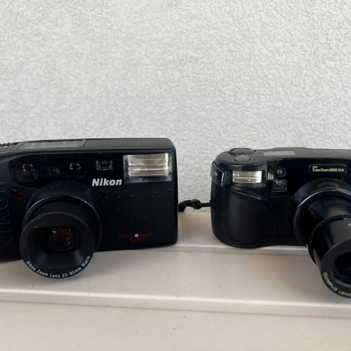 Olympus Super Zoom and Nikon Zoom Touch 600 cameras used