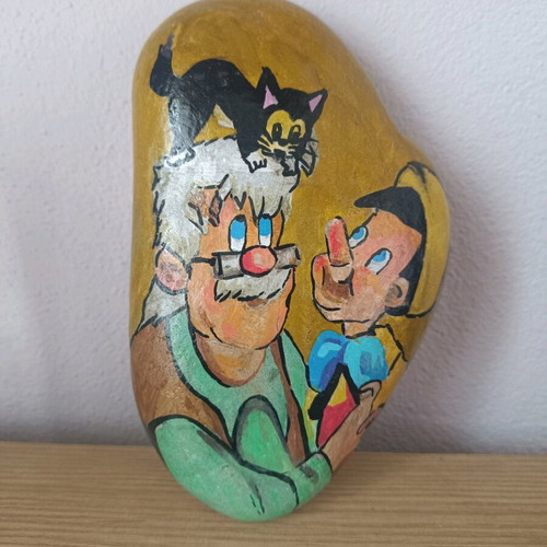 Painted stone new with acrylic colors and glossy varnish