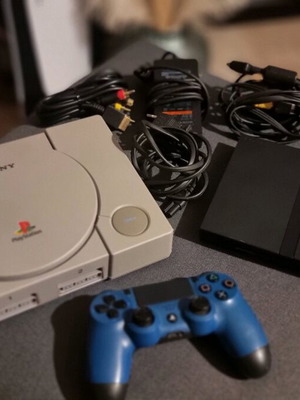 Sony PlayStation 1 and 2 used consoles with extra cables and PS4 controller parts