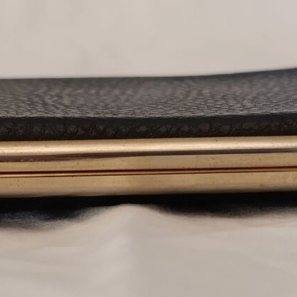 Classic cigarette case used, black leatherette with bronze interior