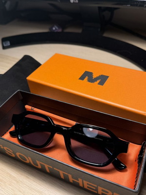 Meller Cumbi unisex sunglasses black with blue polarized lenses