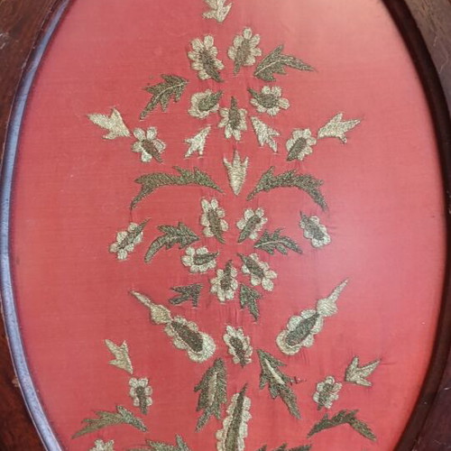 Embroidered textile painting with gold thread, used