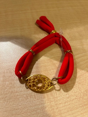 Red bracelet new with pouch