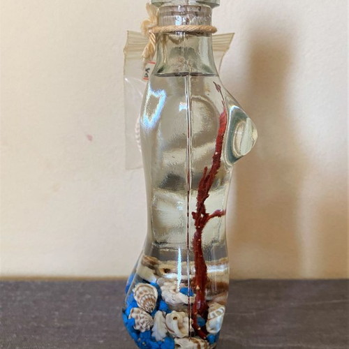 Female figure candle new with shells and stones