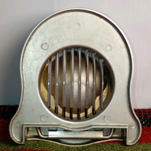 Metal egg slicer used