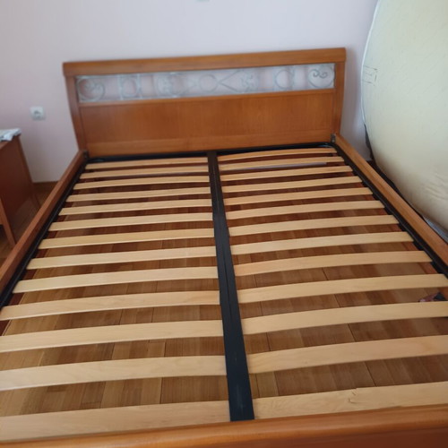 Double bed with decorated beech wood headboard