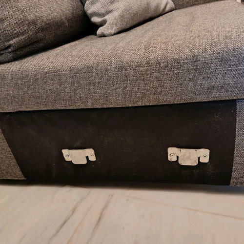 Three-seater sofa used in gray color with two cushions