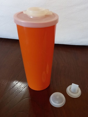 Tupperware tall brick-red glass 450ml with lid and 3 stoppers like new