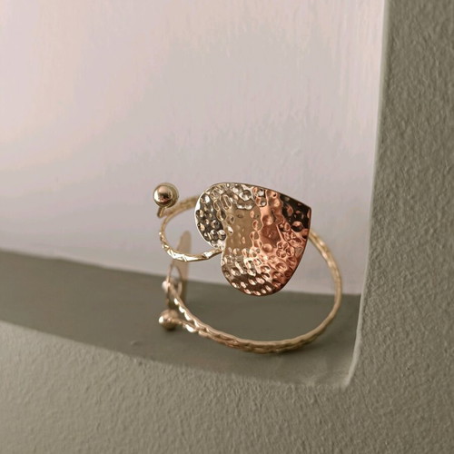 Cuff bracelet used with 2 gold-tone hearts