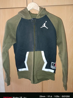 Jordan kids jacket used for ages 10 to 12, black and beige