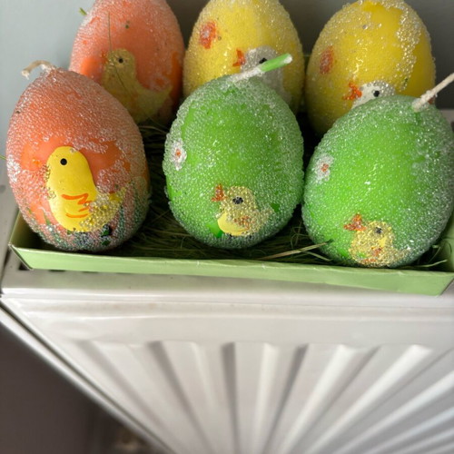Easter candles shaped like eggs like new, painted
