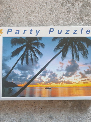 Party Puzzle 500 pieces used with sunset and palm trees