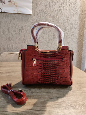 Red handbag new with strap and pockets