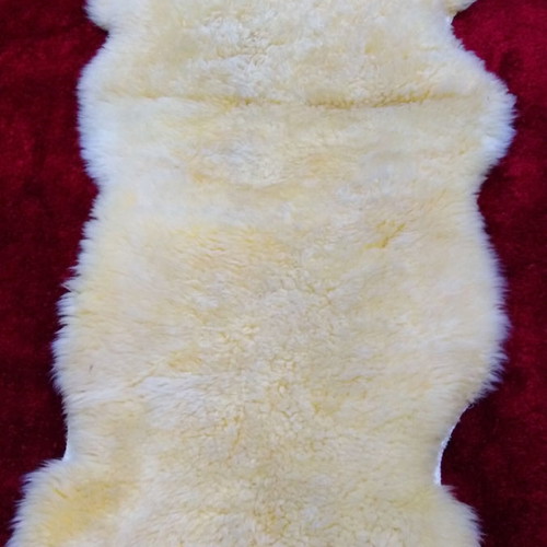 Sheepskin rug new, champagne color 2.05x0.75