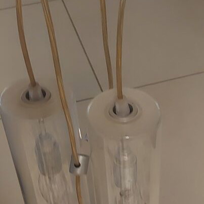 Ceiling light with four transparent cables