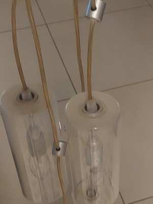 Ceiling light with four transparent cables