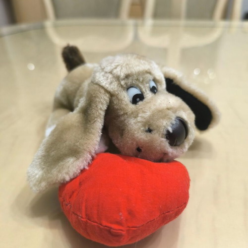 Plush dog with red heart like new
