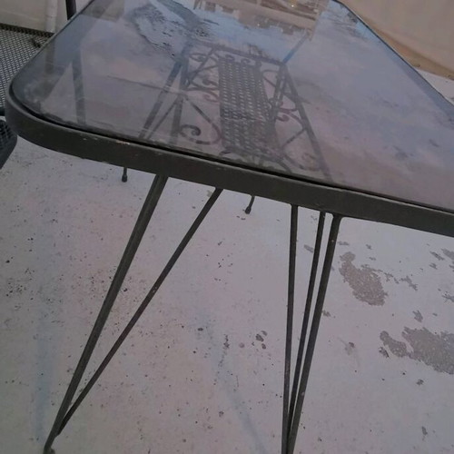 Metal double sofa and glass table used for garden or terrace