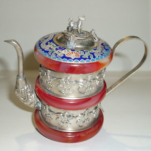 Teapot old made of porcelain and nephrite used