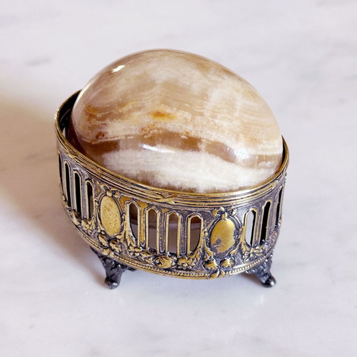 Vintage decorative egg from natural onyx stone in carved silver-plated base used