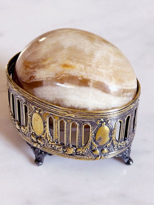 Vintage decorative egg from natural onyx stone in carved silver-plated base used