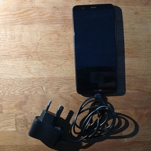 Huawei smartphone 2018 model, black, with 2 extra chargers