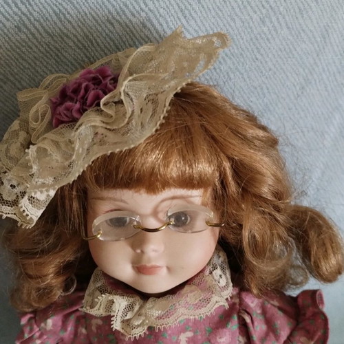 Porcelain doll vintage used with hand damage