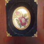 Set of 3 embroidered textile paintings in velvet frames