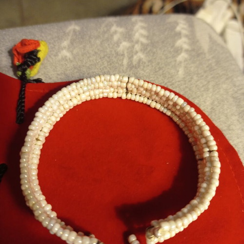 Vintage bracelet used with multiple rows of tiny white beads