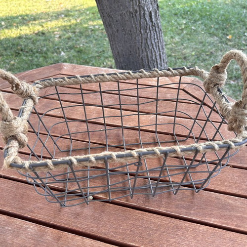 Boho style decorative basket with natural rope handles