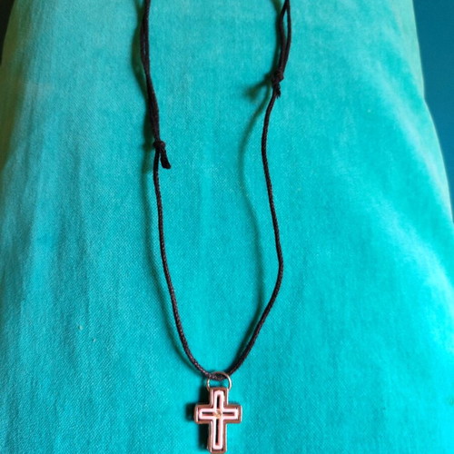 Cross made of silver and pink stainless steel new with adjustable cord