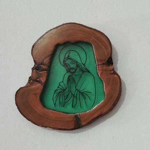Handmade religious icon on natural wood slice with resin finish