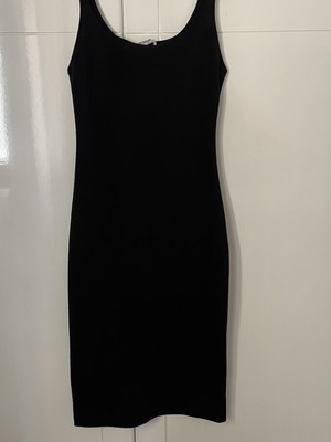 Zara black dress used, knee-length with back slit, size S