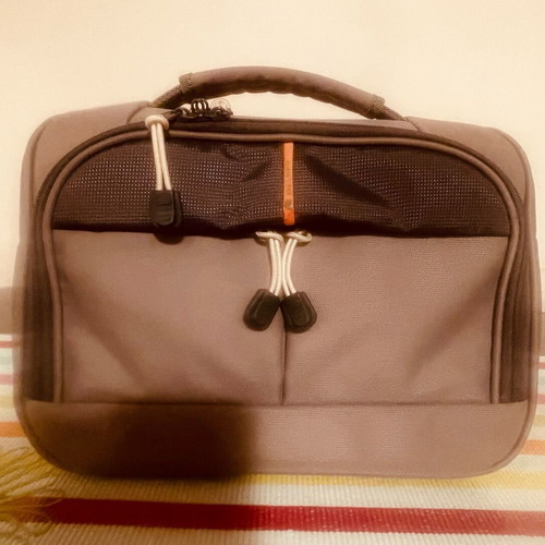 Delsey toiletry bag like new, gray with 2 compartments and shoulder strap