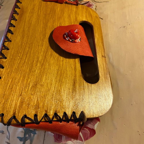 Wooden handmade bag with red leather stitched by hand