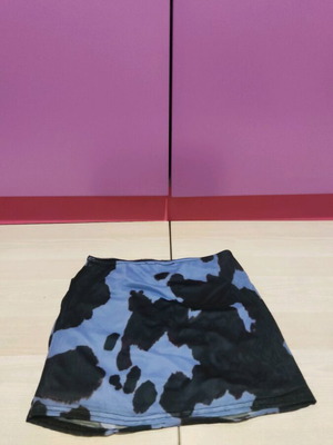 Asos mini skirt new, size XS, blue with cow print design