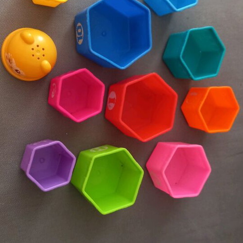 Activity toy pyramid with cups used